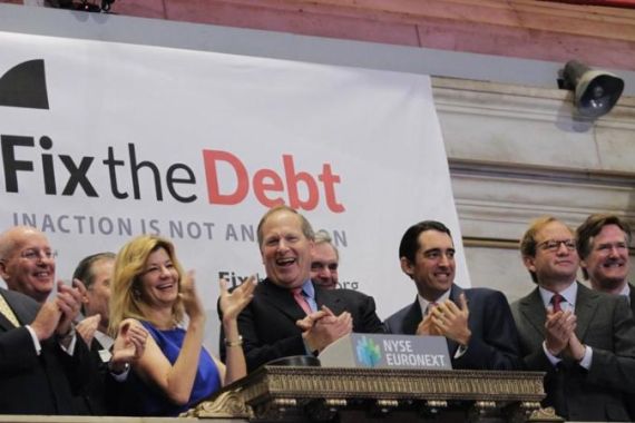 MacGuineas, president of the Committee for a Responsible Federal Budget and Cote, CEO of Honeywell international part of the Campaign to Fix the Debt, are joined by supporters to ring the opening bell at the New York Stock Exchange