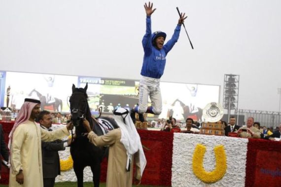 Dettori, riding Skysurfers of Britain, celebrates after winning the third race of the 16th Dubai World Cup at the Meydan Racecourse in Dubai