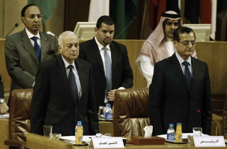 Arab League Secretary-General Nabil al-Araby and foreign ministers observe a minute of silence for victims of the military operation in the Gaza Strip at the Arab League headquarters in Cairo