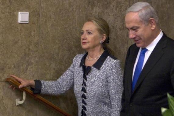 Israel''s Prime Minister Netanyahu walks with U.S. Secretary of State Clinton upon her arrival to their meeting in Jerusalem