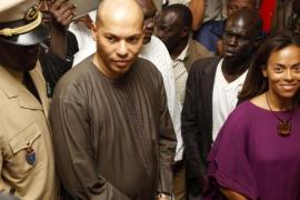 File photo of Karim Wade and Sindiely Wade, children of Senegal''s President Abdoulaye Wade, during presidential elections in Dakar