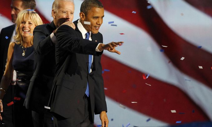 U.S. President Barack Obama (R) celebrates with Vice President Joe Biden