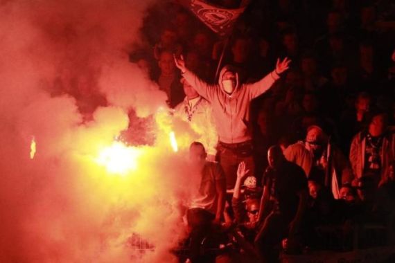 File photo of Hertha Berlin''s supporters lighting flares during German Bundesliga first division relegation soccer match