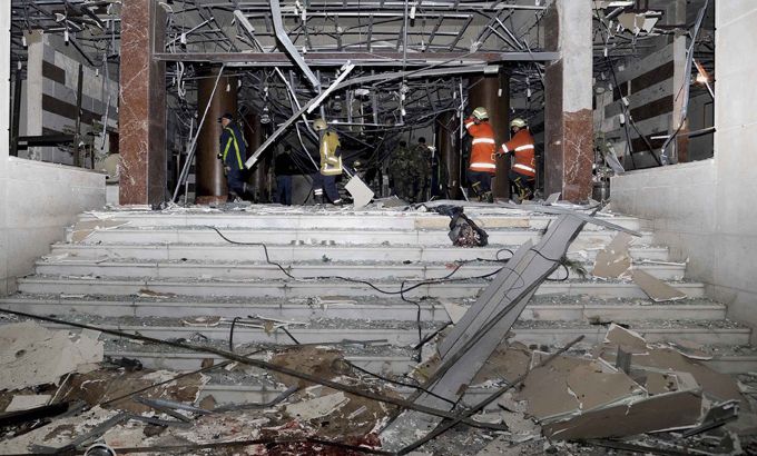 A damaged area is pictured after an explosion hit the main gate of the Syrian Interior Ministry