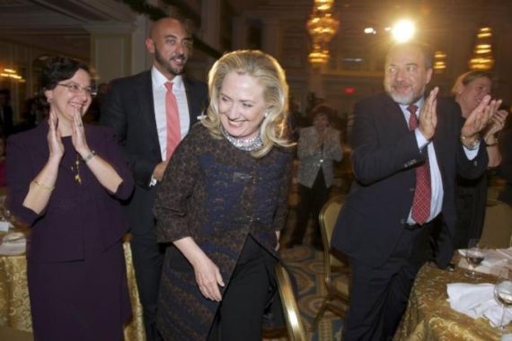 U.S. Secretary of State Hillary Clinton is applauded by Wittes, al-Rumaihi, and Israeli Foreign Minister Lieberman, at the 2012 Saban Forum on U.S.-Israel Relations, at the Willard Intercontinental Hotel in Washington