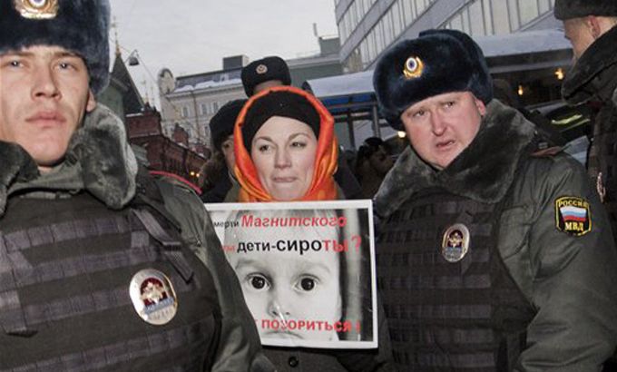 Russian police arrest protesters opposed to adoption ban