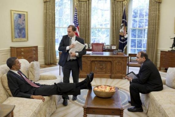 White House handout shows U.S. President Obama talks with Deputy National Security Advisor for Strategic Communication Rhodes and Senior Advisor Axelrod in the Oval Office