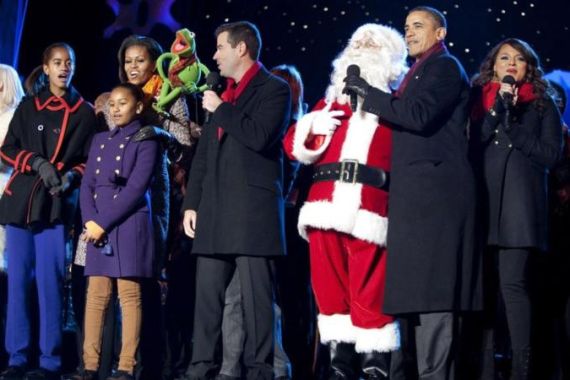 U.S. President Obama sings a Christmas carol with his family during the lighting of the National Christmas Tree in Washington