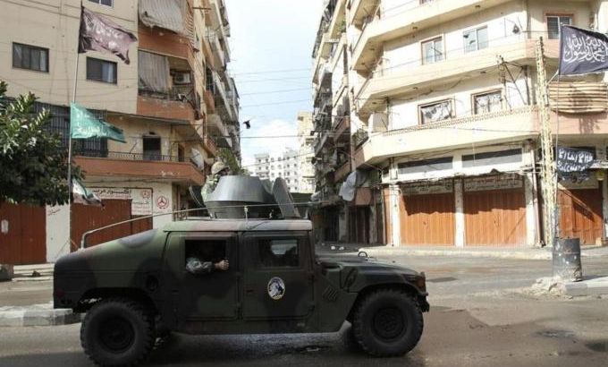 Lebanese army soldiers patrol in their vehicle in the Sunni Muslim-dominant neighbourhood of Bab al-Tebbaneh in Tripoli, northern Lebanon, during clashes between Sunni Muslims and Alawites