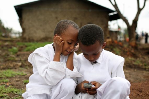 Boys play with mobile phone