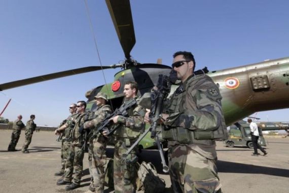 French soldiers line up during a visit of Mali''s Prime Minster Django Cissoko at the Mali air force base near Bamako