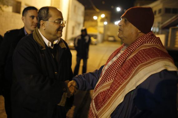 Israeli Arab Parliament member Ahmed Tibi (C) of the Ra''am-Ta''al party shakes hands with a man as he campaigns ahead of a January 22 general election in the Israeli Arab town of Tira January 13, 2013.