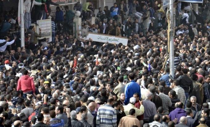 Mourners attend the funerals of 33 people who died on Saturday, during clashes provoked by a court verdict on a deadly stadium disaster last year, in Port Said