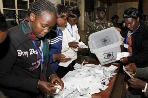Electoral officials sort out ballots before counting votes at a polling centre in Eldoret town