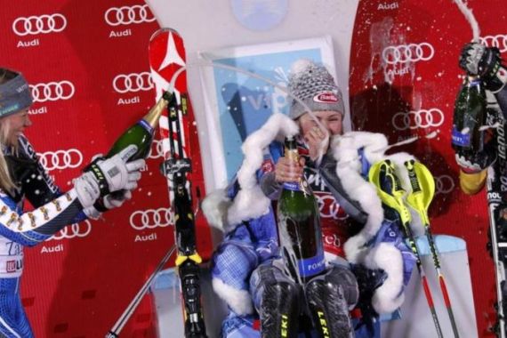 Second-placed Hansdotter of Sweden, winner Shiffrin of the U.S. and third-placed Mielzynski of Canada spray champagne after the Alpine Skiing World Cup women''s slalom ski race in Zagreb