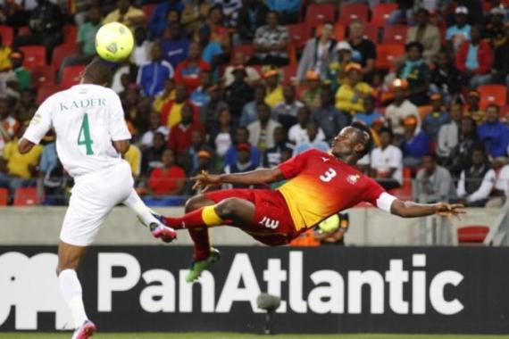 Ghana''s Asamoah Gyan executes a bicycle kick past Niger''s Adama Coulibaly during their African Nations Cup Group B soccer match at the Nelson Mandela Bay Stadium in Port Elizabeth