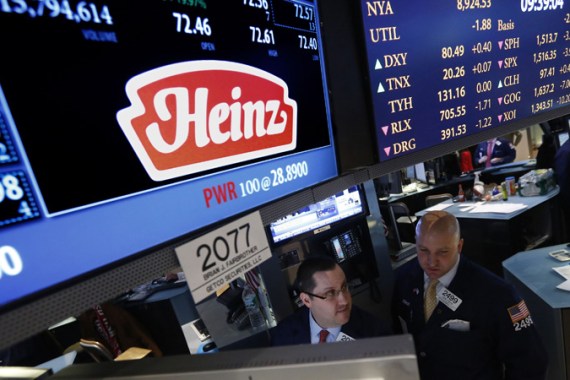 Traders work at the post that trades H.J. Heinz Co. on the floor of the New York Stock Exchange