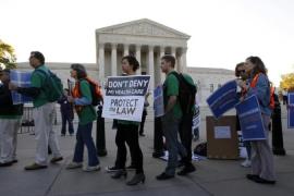 Supporters of U.S. President Barack Obama''s healthcare law, march outside the Supreme Court in Washington