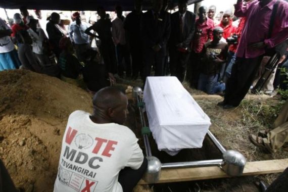 People attend the funeral of 12-year-old boy Christpowers Maisiri, who died after he was set on fire, in the rural village of Headlands