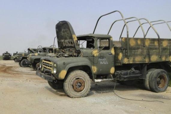 A view shows military vehicles which belonged to forces loyal to al-Assad at the regime''s 80th Brigade''s base after the base was seized control by the Free Syrian Army fighters near Aleppo International Airport
