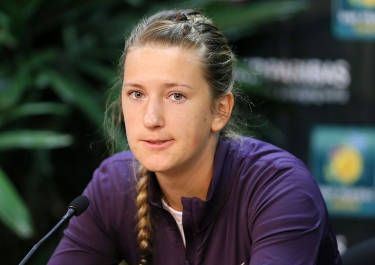 Victoria Azarenka of Belarus talks about withdrawing from the tournament due to a right ankle injury before her quarterfinal match against Caroline Wozniacki of Denmark at the BNP Paribas Open WTA tennis tournament in Indian Wells, California