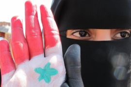 A Yemeni woman shows the palm of her han