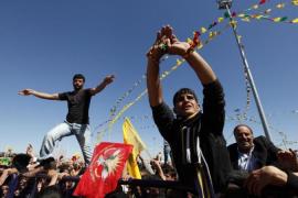 Demonstrators attend a gathering to celebrate Newroz in the southeastern Turkish city of Diyarbakir