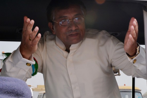 Pakistan''s former military ruler Pervez Musharraf gestures upon his arrival at the Karachi International airport from Dubai, in Karachi on March 24, 2013. Pakistan''s former military ruler Pervez Musharraf returned home after more than four years in exile, defying a Taliban death threat to contest historic general elections. AFP PHOTO/ AAMIR QURESHI