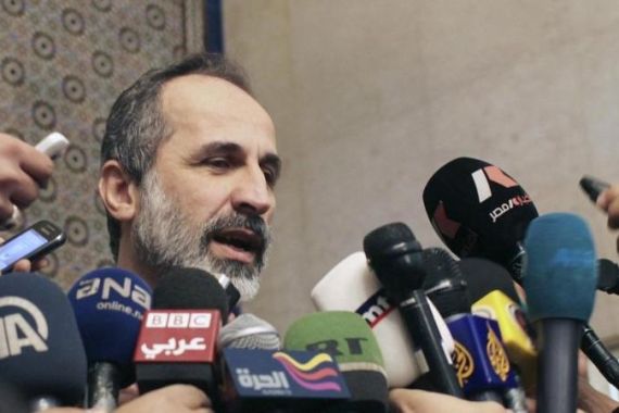 File photo of Syrian National Coalition leader Moaz Alkhatib speaking to the media in Cairo