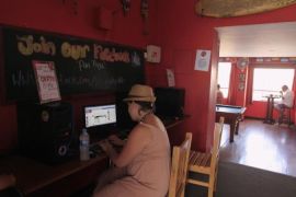 A tourist is seen looking at the Facebook website at a backpacker hostel in Lima