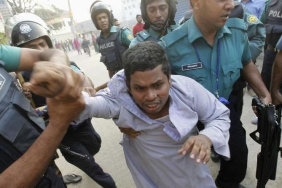 Police arrest a man suspected to be from Bangladesh Jamaat-e-Islami activist during a two-day long strike in Dhaka