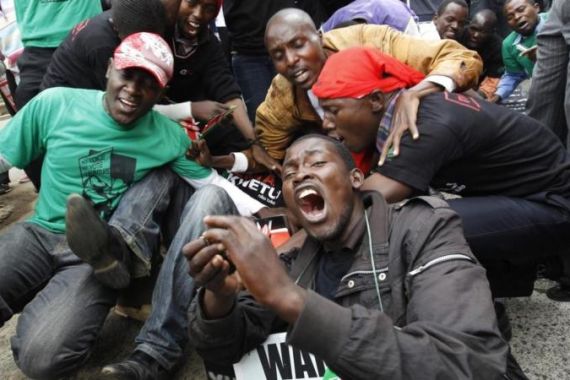 Activists shout slogans during a protest in Nairobi