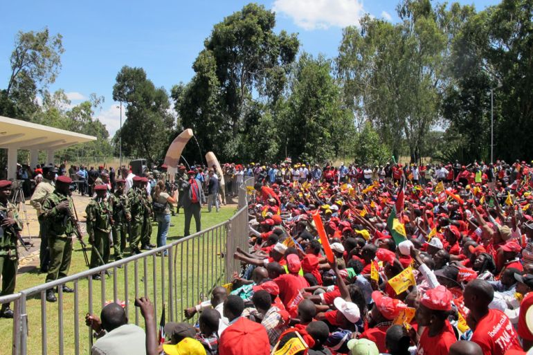TNA supporters wait in the sun for President-elect Uhuru Kenyatta to arrive