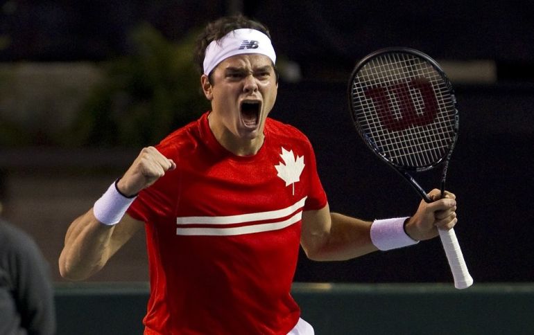 Canada''s Raonic celebrates beating Italy''s Seppi in their Davis Cup quarter-final tennis match in Vancouver