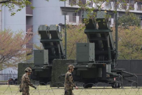 Members of the Japan Self-Defence Forces deploy PAC-3 missiles at the Defence Ministry in Tokyo