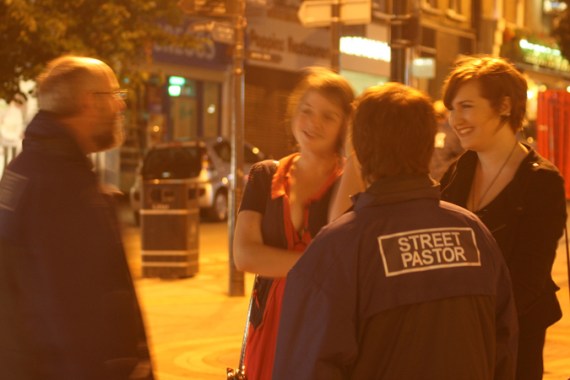 Street Pastors talk to young people in Sutton, London. Credit: Adam Bonner and Nat Gillett
