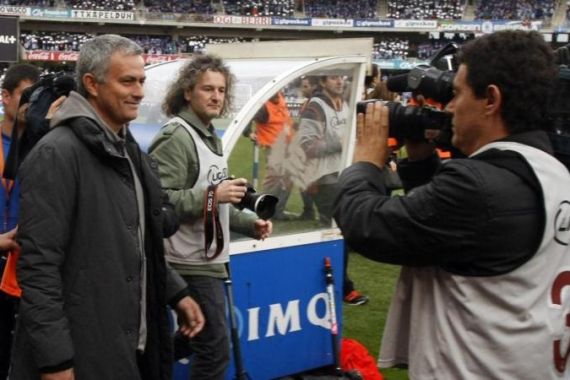 Real Madrid''s coach Mourinho smiles as he enters pitch before their Spanish first division soccer match against Real Sociedad at Anoeta stadium in San Sebastian