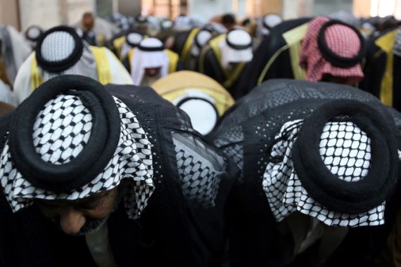 Iraqi Sunni and Shiite Muslim worshipers perform a joint Friday prayer