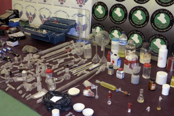 Laboratory equipment and chemicals are seen on display during a news conference at the Defence Ministry in Baghdad
