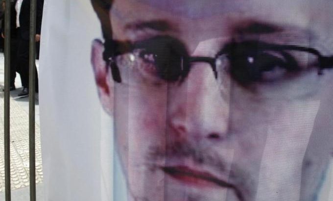 A banner supporting Edward Snowden is displayed at Hong Kong''s financial Central district