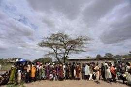 Turkana women and children wait for supp