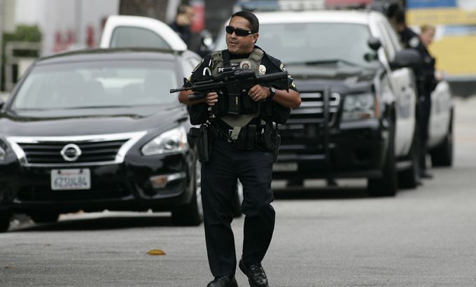 A police officer walks on the street during a search at Santa Monica College