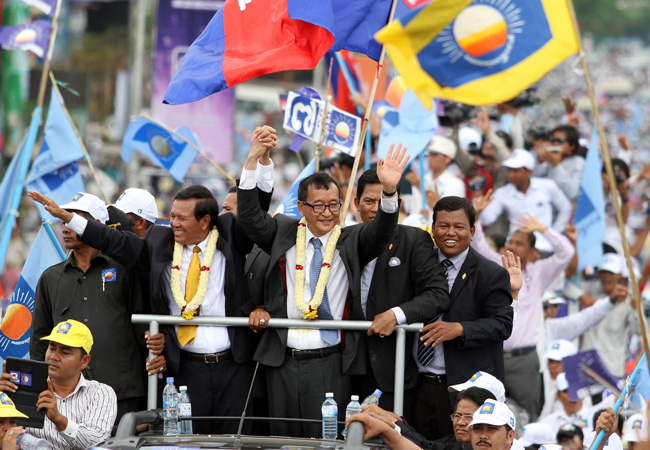 Cambodian opposition leader Cambodia National Rescue Party (CNRP) Sam Rainsy (centre R)