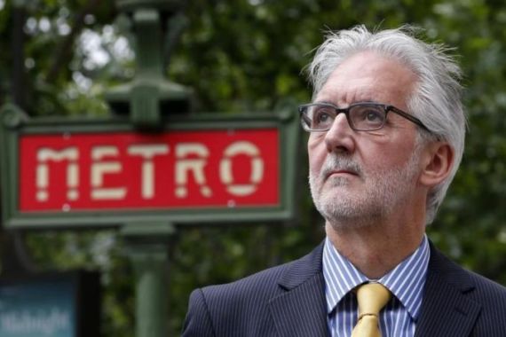 British Cycling President Brian Cookson poses in front of a metro station next to the building where the International Cycling Union was founded in Paris