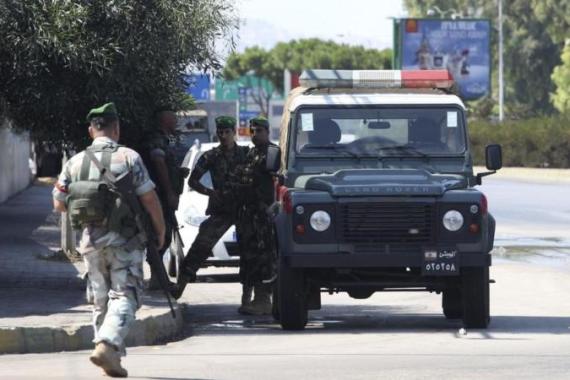 Lebanese Army soldiers patrol the road leading to Beirut international airport, following the kidnap of a Turkish airlines pilot and his colleague in Beirut