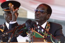 Zimbabwe''s President Mugabe addresses the crowd gathered to commemorate Heroes Day in Harare