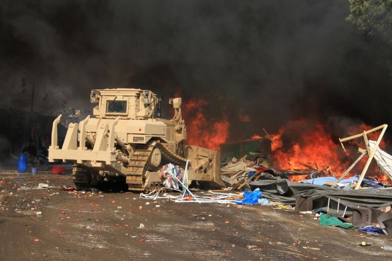 AP PHOTOS: Egypt cracks down on pro-Morsi camps