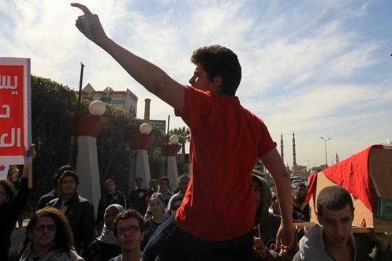 An Egyptian student shouts slogans as ot