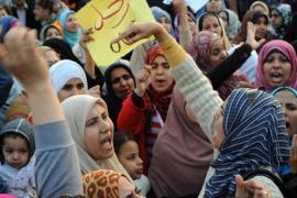 Egyptians women shout slogans during a d