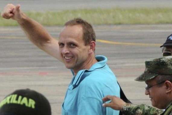 Wobert gestures to the media while arriving at Barrancabermeja airport